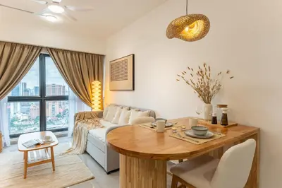 a living room with a table and a couch at TRX View Muji Room 5 min to Bukit Bintang at Agile in Kuala Lumpur