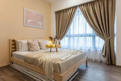 a bedroom with a bed with a large window at TRX View Muji Room 5 min to Bukit Bintang at Agile in Kuala Lumpur