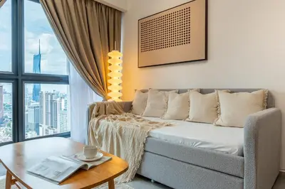 a living room with a couch and a table at TRX View Muji Room 5 min to Bukit Bintang at Agile in Kuala Lumpur