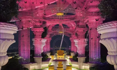 a room with pink and purple walls and columns at Duplex Arte Mont kiara 2 bedroom in Kuala Lumpur