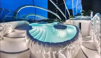 a water park in a city at night at Arte mont kiara duplex 2 bedroom in Kuala Lumpur