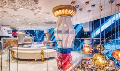 a glass display case with a bunch of vases at Arte mont kiara duplex 2 bedroom in Kuala Lumpur