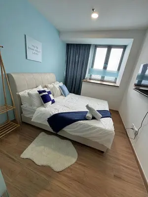a bedroom with a large bed and a window at Riveria City, Kl Sentral Studio Apartment near Monorail, Infinity Pool in Kuala Lumpur