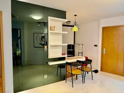 a kitchen with a table and chairs in a room at Vortex Suites By Asian in Kuala Lumpur