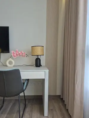 a white desk with a lamp and a chair at Comfort Luxury Studio Kuala Lumpur Free Netflix #S3 in Kuala Lumpur