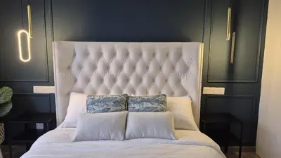 a large white bed with two pillows on it at Design House Kuala Lumpur #P3 in Kuala Lumpur