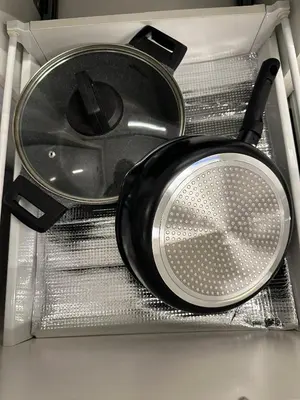 a pot and skillet sitting on top of a drawer at The Establishment LOFT Bangsar KL Sentral by \u54c1\u5c4b PINWU Shortstay in Kuala Lumpur