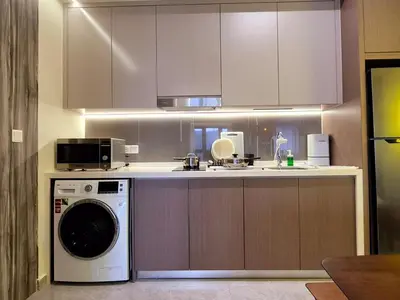 a kitchen with a washer and a dishwasher at Agile Kuala Lumpur 4min TRX Pavillion #P8 in Kuala Lumpur