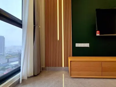a living room with a television and a window at Agile Kuala Lumpur 4min TRX Pavillion #P8 in Kuala Lumpur
