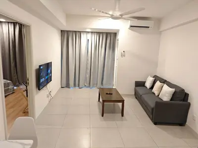 a living room with a couch and a table at The Atrium Jalan Ampang KLCC in Kuala Lumpur