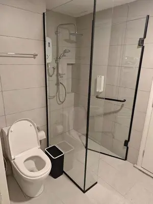 a bathroom with a shower and a toilet at The Atrium Jalan Ampang KLCC in Kuala Lumpur