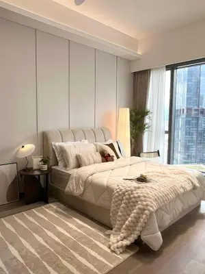 a bedroom with a large bed and a large window at Core Residence at TRX by LL in Kuala Lumpur