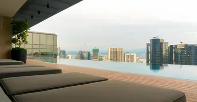 a balcony with a view of a city skyline at Core Residence at TRX by LL in Kuala Lumpur