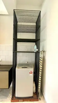 a small refrigerator in a metal shelf in a kitchen at 2 Bedroom Apartment l City View in Kuala Lumpur
