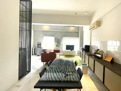 a living room with a table in the middle of a room at 2 Bedroom Apartment l City View in Kuala Lumpur
