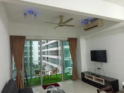 a living room with a ceiling fan and a large window at Serene Haven in Kuala Lumpur