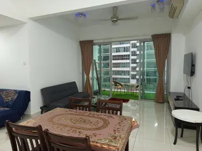 a living room with a table and a couch at Serene Haven in Kuala Lumpur