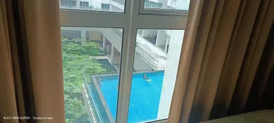 a view of a swimming pool from a hotel room window at Serene Haven in Kuala Lumpur