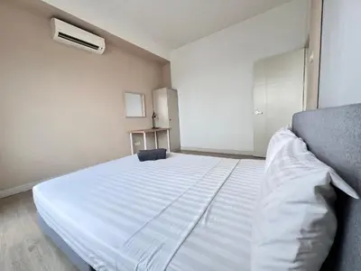 a bedroom with a large white bed in it at Arte Plus Ampang By Comfortstay in Kuala Lumpur
