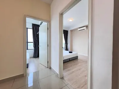 a bathroom with a large mirror and a bath tub at Arte Plus Ampang By Comfortstay in Kuala Lumpur