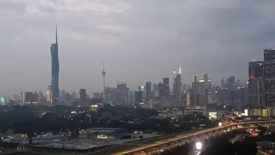 a view of a city at night with at Twin Tower View Homestay Kuala Lumpur in Kuala Lumpur