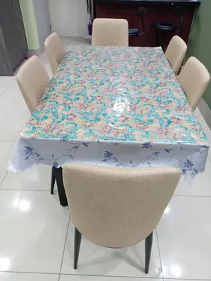 a table with a floral table cloth on top of it at Twin Tower View Homestay Kuala Lumpur in Kuala Lumpur