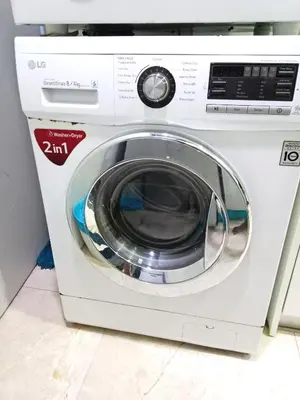a white washing machine sitting in a room at Vortex Suites KLCC By Farysha in Kuala Lumpur