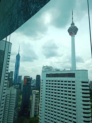 a view of the space needle tower in a city at Vortex Suites KLCC By Farysha in Kuala Lumpur