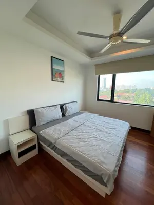 a bedroom with a bed and a ceiling fan at Near Jalan Alor in Kuala Lumpur