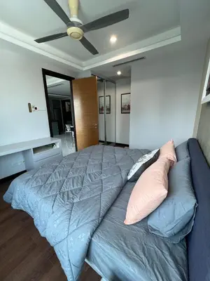 a bedroom with a bed and a ceiling fan at Comfy place near Bukit in Kuala Lumpur