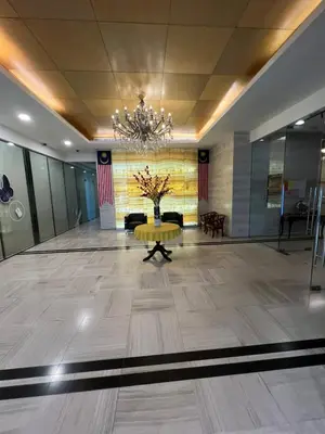 a large lobby with a table and a chandelier at Comfy place near Bukit in Kuala Lumpur