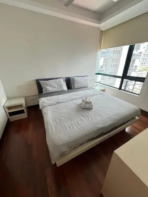 a large bed in a room with a large window at Spacious and Inviting casa Residence in Kuala Lumpur