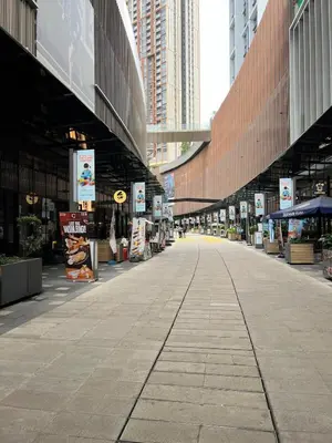 an empty street in a city with tall buildings at Spacious and Inviting casa Residence in Kuala Lumpur