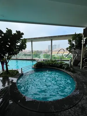 a large swimming pool in the middle of a building at Spacious and Inviting casa Residence in Kuala Lumpur