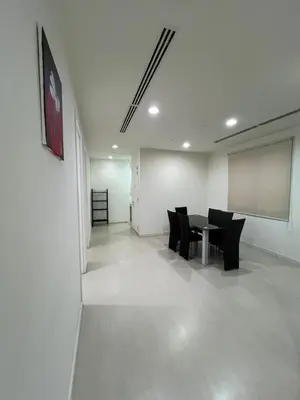 a conference room with a table and chairs and a screen at Convenient KLCC 2-Bedroom Unit in Kuala Lumpur
