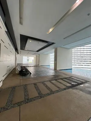 a large empty room with a floor with a rug at Convenient KLCC 2-Bedroom Unit in Kuala Lumpur