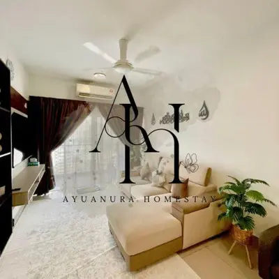 a living room with a ceiling fan and a couch at Ayuanura Homestay in Kuala Lumpur