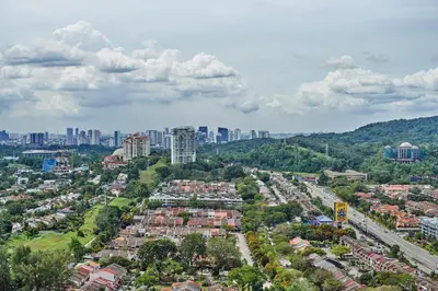 an overhead view of a city with buildings and trees at Dorsett Residences Sri Hartamas, Mont Kiara Kuala Lumpur in Kuala Lumpur