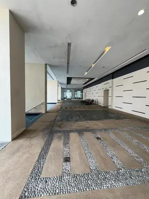 an empty room with a rug on the floor at Convenient KLCC in Kuala Lumpur