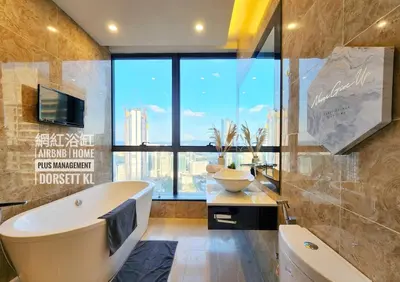 a bathroom with a tub and a sink and a large window at Dorsett Residence TRX KLCC #25 in Kuala Lumpur