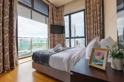 a bedroom with a bed and a large window at Dorsett Residence TRX KLCC #25 in Kuala Lumpur