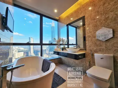 a bathroom with a tub and a large window at Dorsett Residence TRX KLCC #25 in Kuala Lumpur