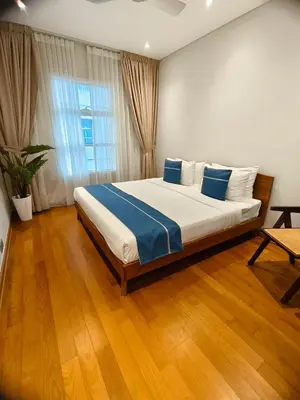 a bedroom with a large bed in a room at Sky Suites KLCC Apartment by Family Room Stay in Kuala Lumpur