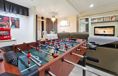 a living room with a ping pong table at Bukit Bintang Fahrenheit #113 KLCC Kuala Lumpur in Kuala Lumpur