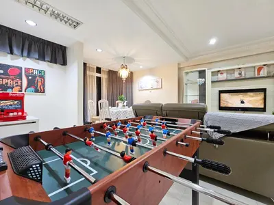 a living room with a foosball table at Bukit Bintang Fahrenheit #113 KLCC Kuala Lumpur in Kuala Lumpur