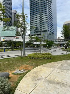 a park in the middle of a city with tall buildings at Great Value City Center Unit in Kuala Lumpur