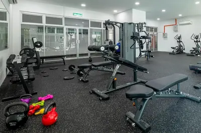a gym with several tread machines and other equipment at RC Residence By Feel Home in Kuala Lumpur