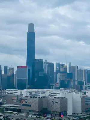 a skyline of a city with a tall skyscraper at KLXXxXxXxX in Kuala Lumpur