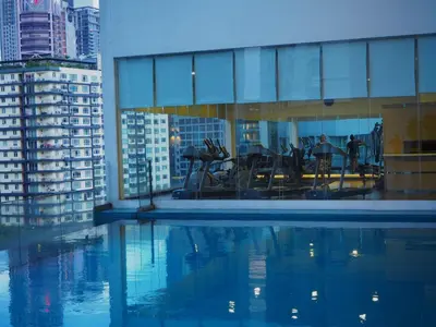 a view of a building with a pool of water at 1Bukit ceylon view 118 in Kuala Lumpur