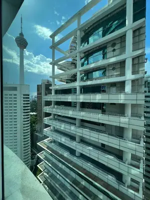 a tall building with a view of the cn tower at Vortex Suites KLCC, 10 Pax - 3 Bedrooms Apartment in Kuala Lumpur